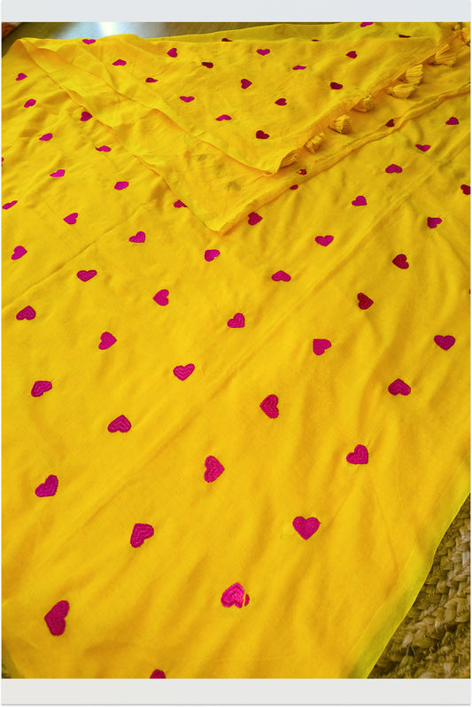 Yellow mul cotton saree with pink embroidered hearts