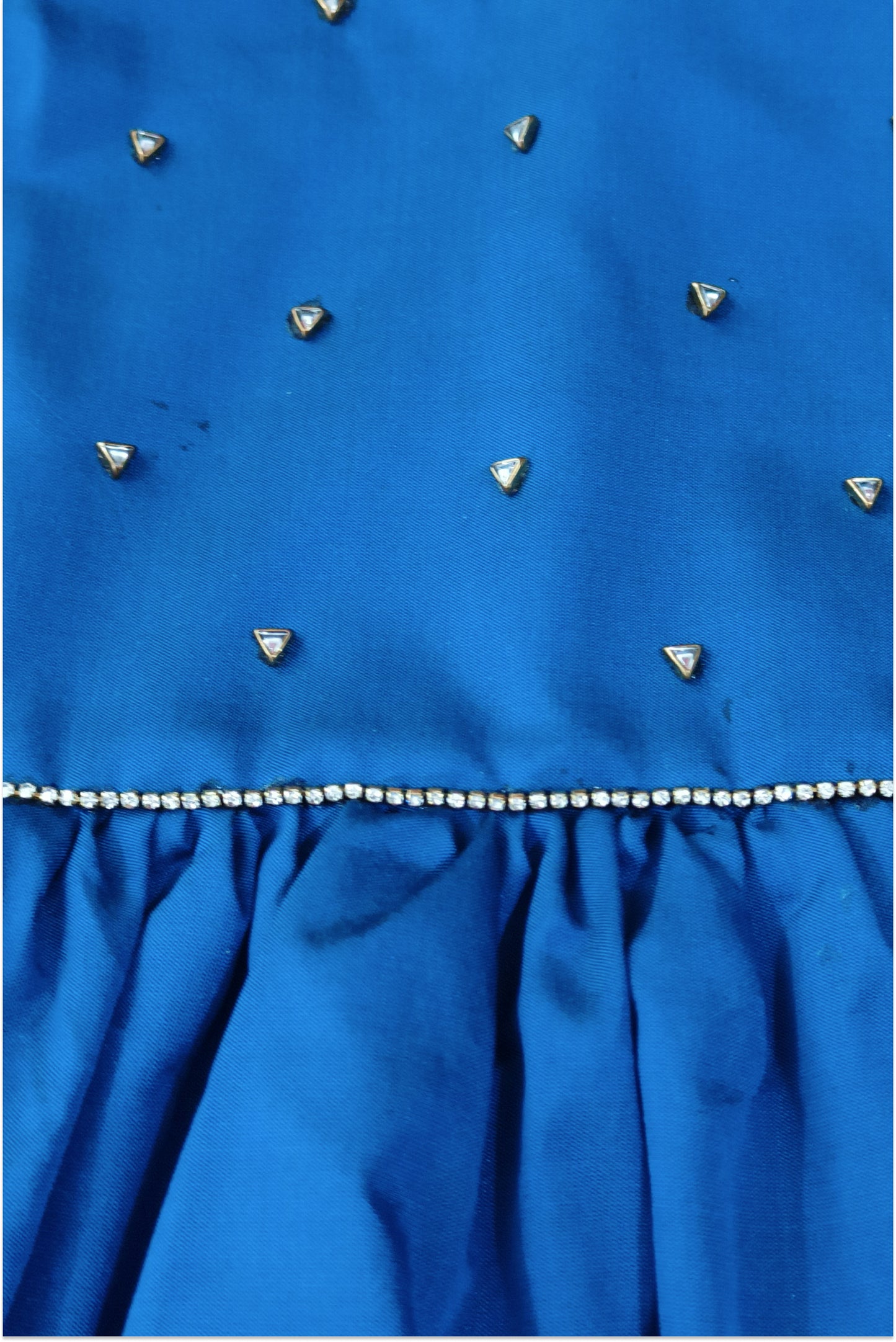 Detailed view of kundan and diamond work pattern on art silk baby dress blue