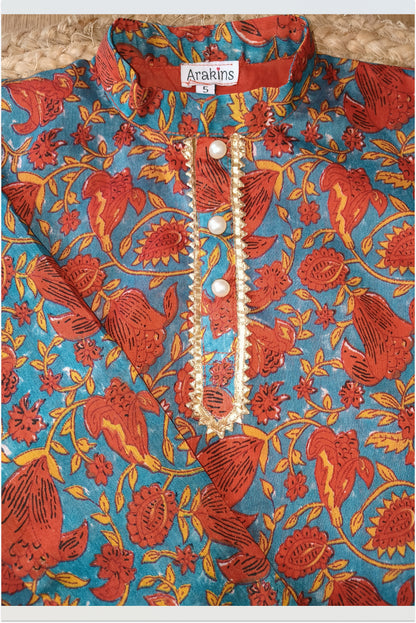 Close up of maroon Chanderi silk blend fabric showing luxurious sheen and texture