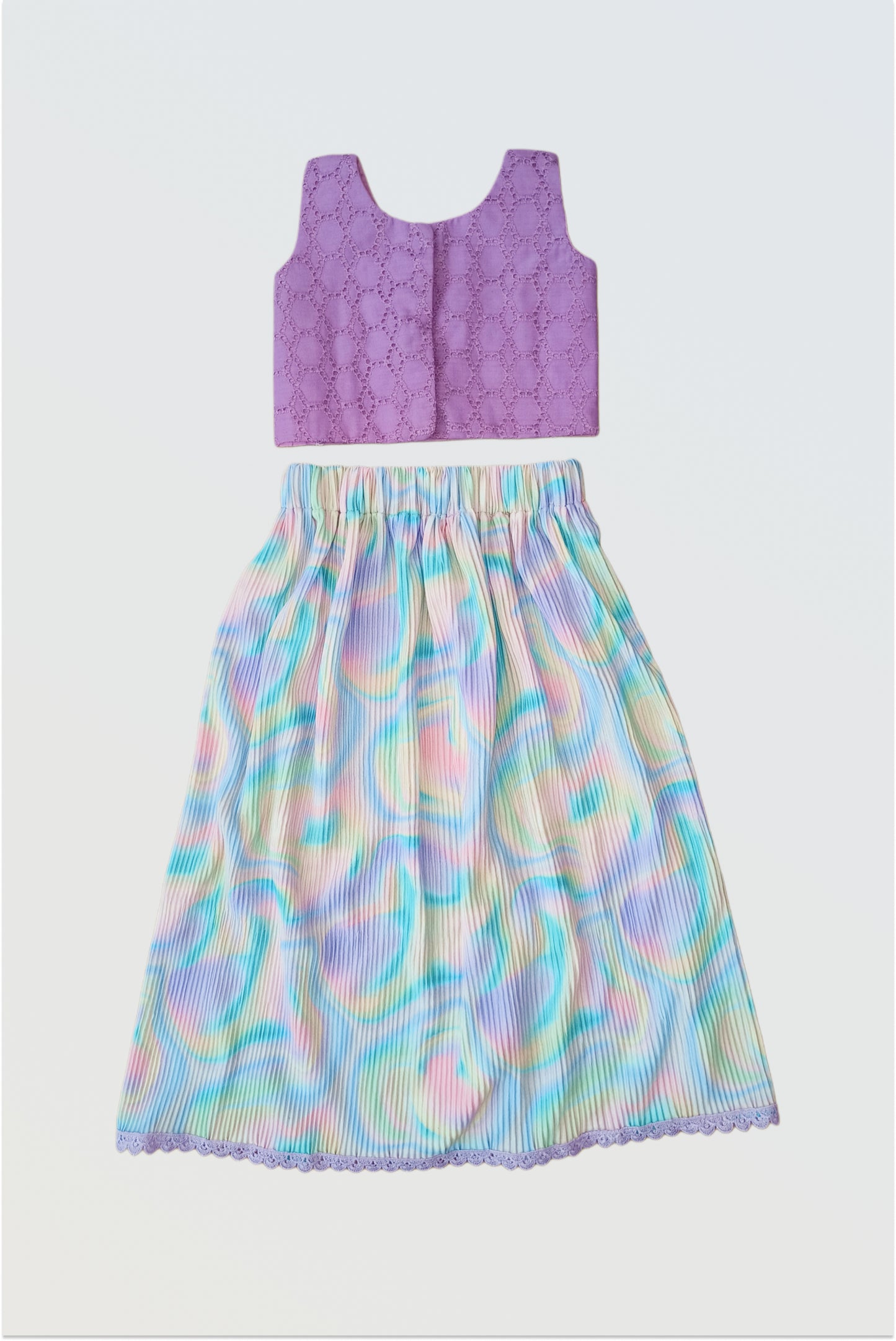 Back view of accordion pleated colourful holi lehanga set showing pleated skirt detail 