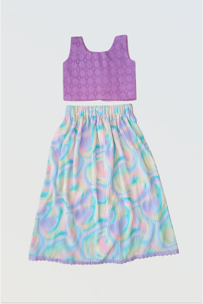 Accordion pleated colourful holi lehanga set flat lay showing hakoba textured choli and colorful pleated skirt