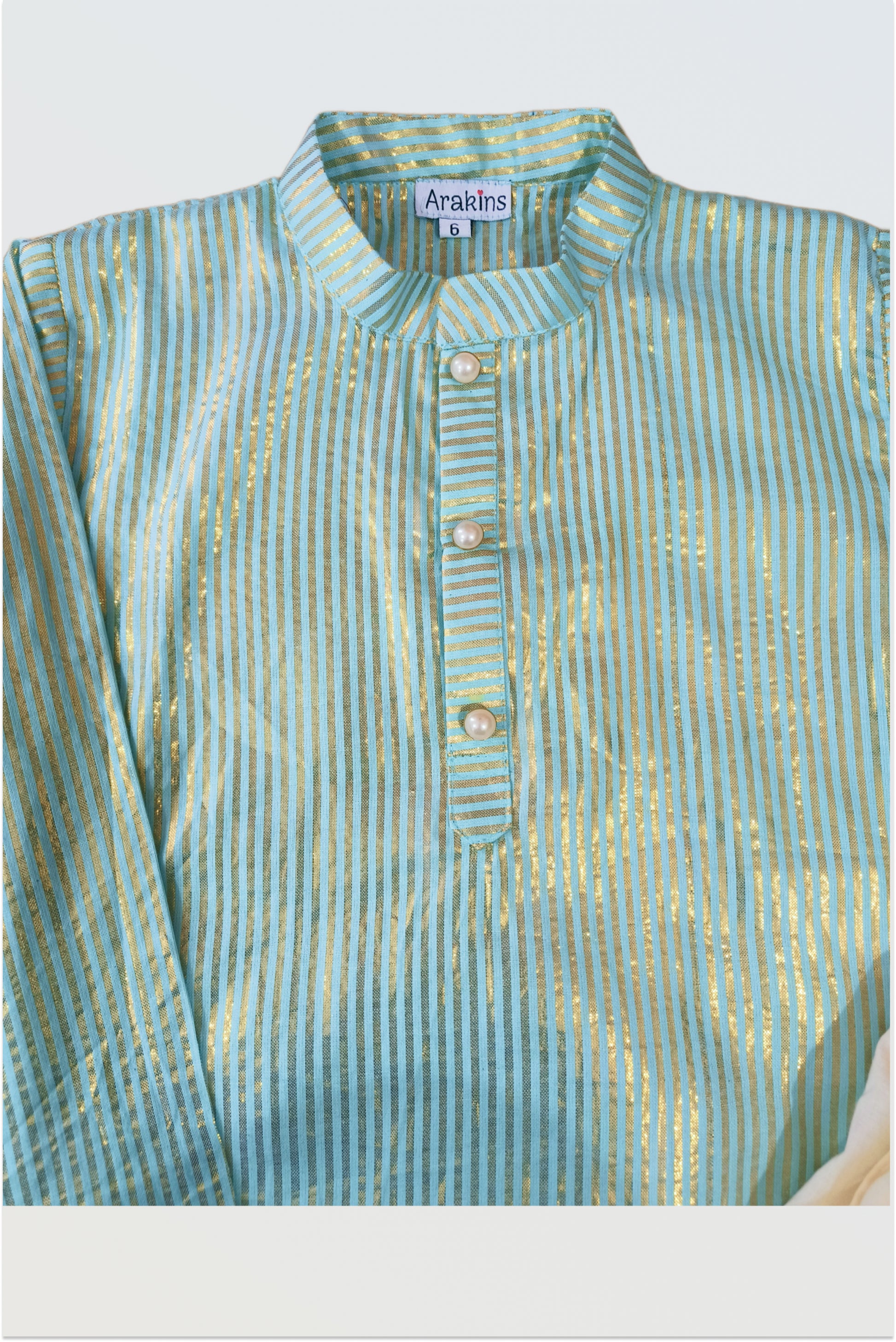 Close up of aqua blue kurta showing golden lurex stripe detail and cotton fabric texture