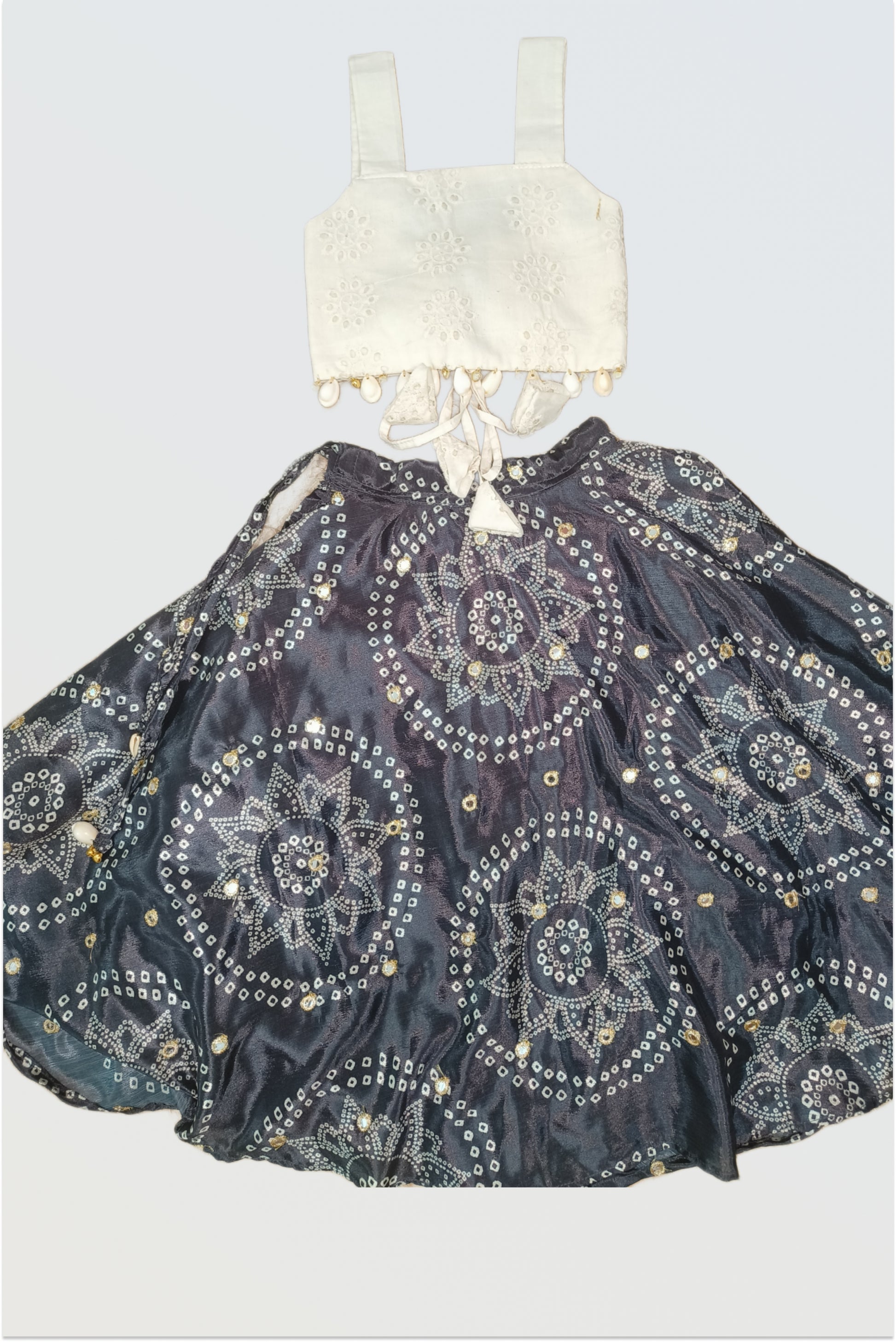 Black bandhani lehanga showing dramatic full flare specifically designed for garba and dandiya dancing