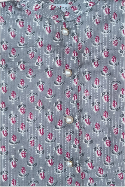 Close up of grey block printed fabric with traditional kantha running stitch embroidery