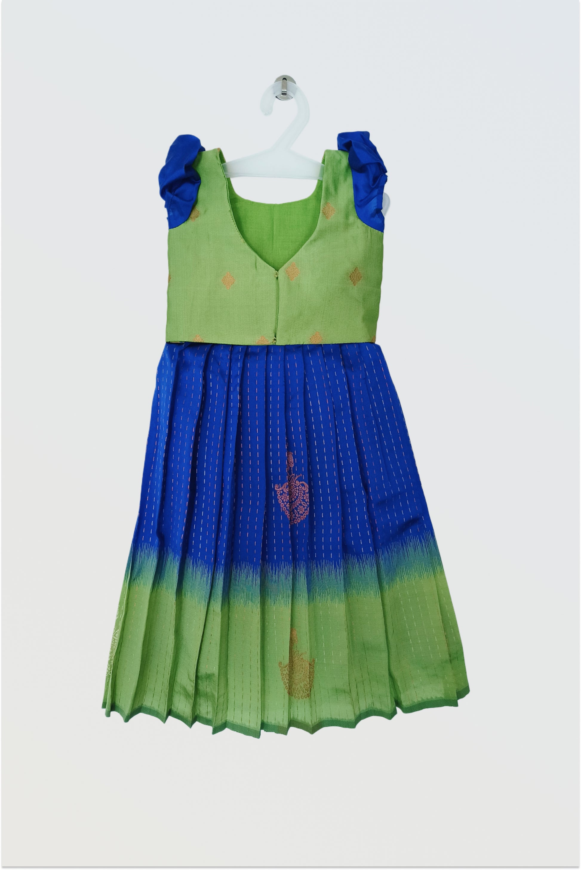 Back view of blue green pattu pavadai showing hook closure and short sleeve construction