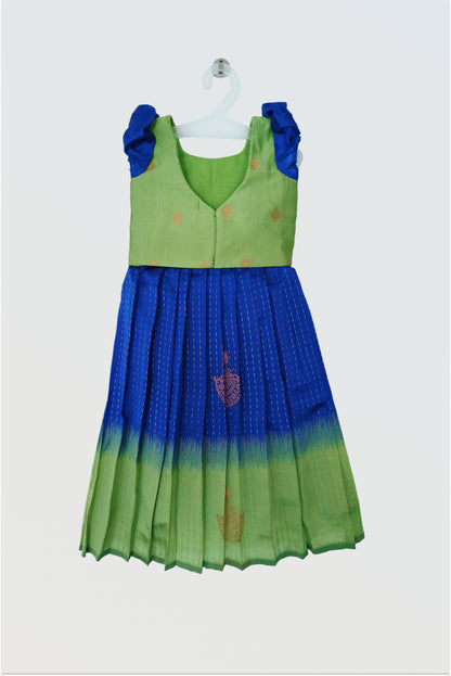 Back view of blue green pattu pavadai showing hook closure and short sleeve construction