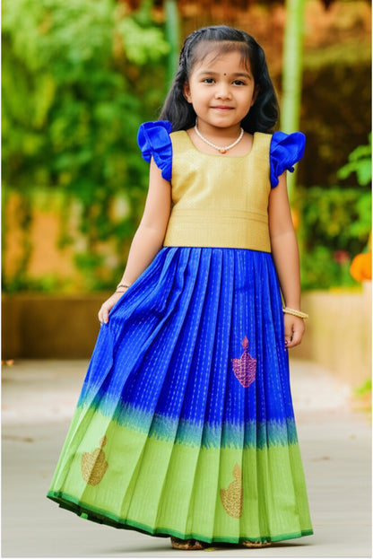 Girl wearing blue green pattu pavadai set - South Indian traditional art silk dress with peacock colors