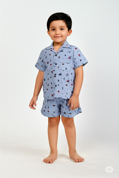 Boy wearing blue collared co-ord set - smart casual summer outfit shirt and shorts