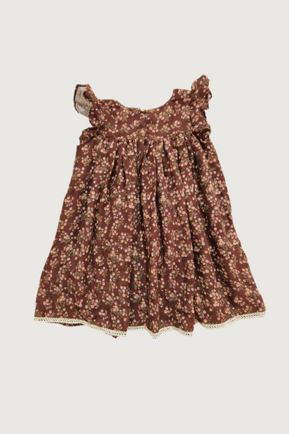 Back view of brown floral dress showing button closure and overall silhouette