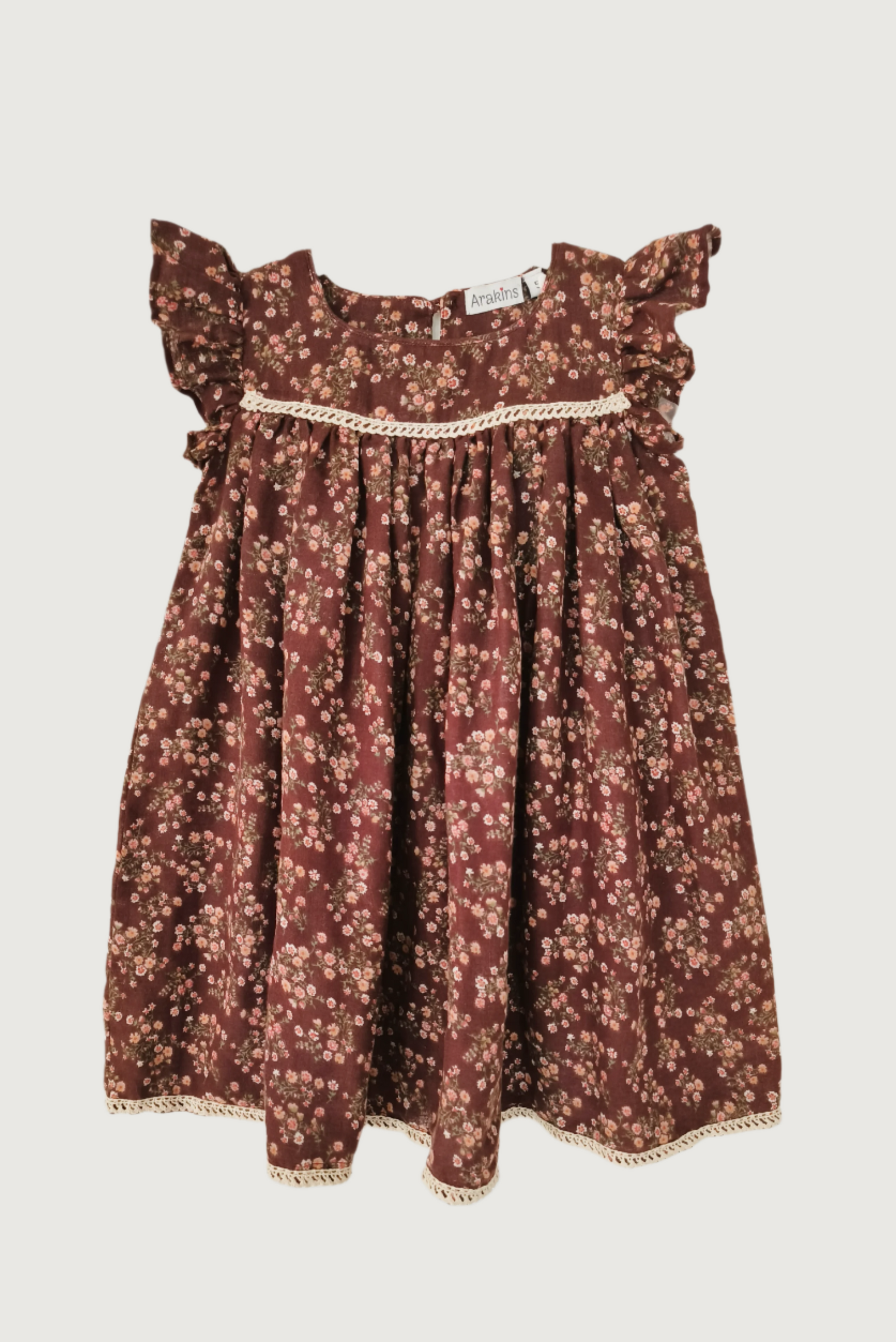 Brown floral flutter sleeve dress flat lay showing empire waist and crochet lace detailing