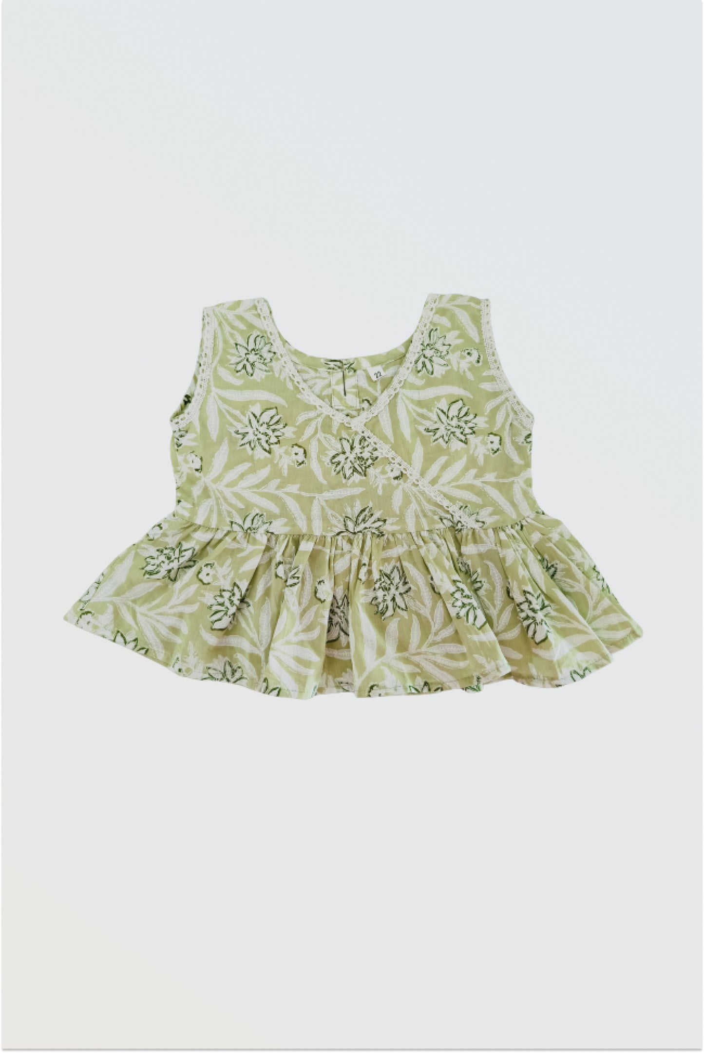 Green ruffled sleeveless top with lace neckline detail for girls summer co-ord set