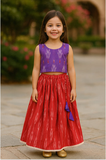Girl wearing ikat cotton lehanga set in purple and red - traditional ethnic wear by Arakins