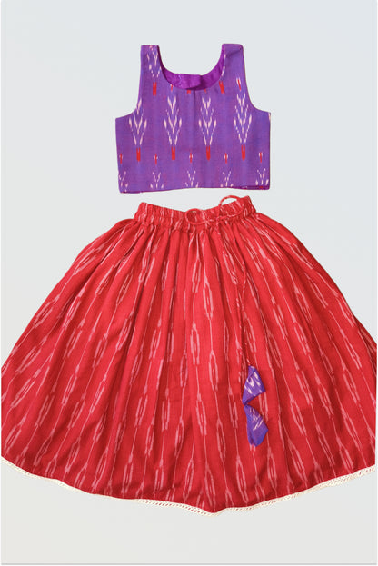 Handwoven ikat lehanga choli set flat lay showing purple blouse and red skirt
