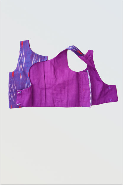 Close up of handwoven ikat fabric showing authentic geometric pattern and texture