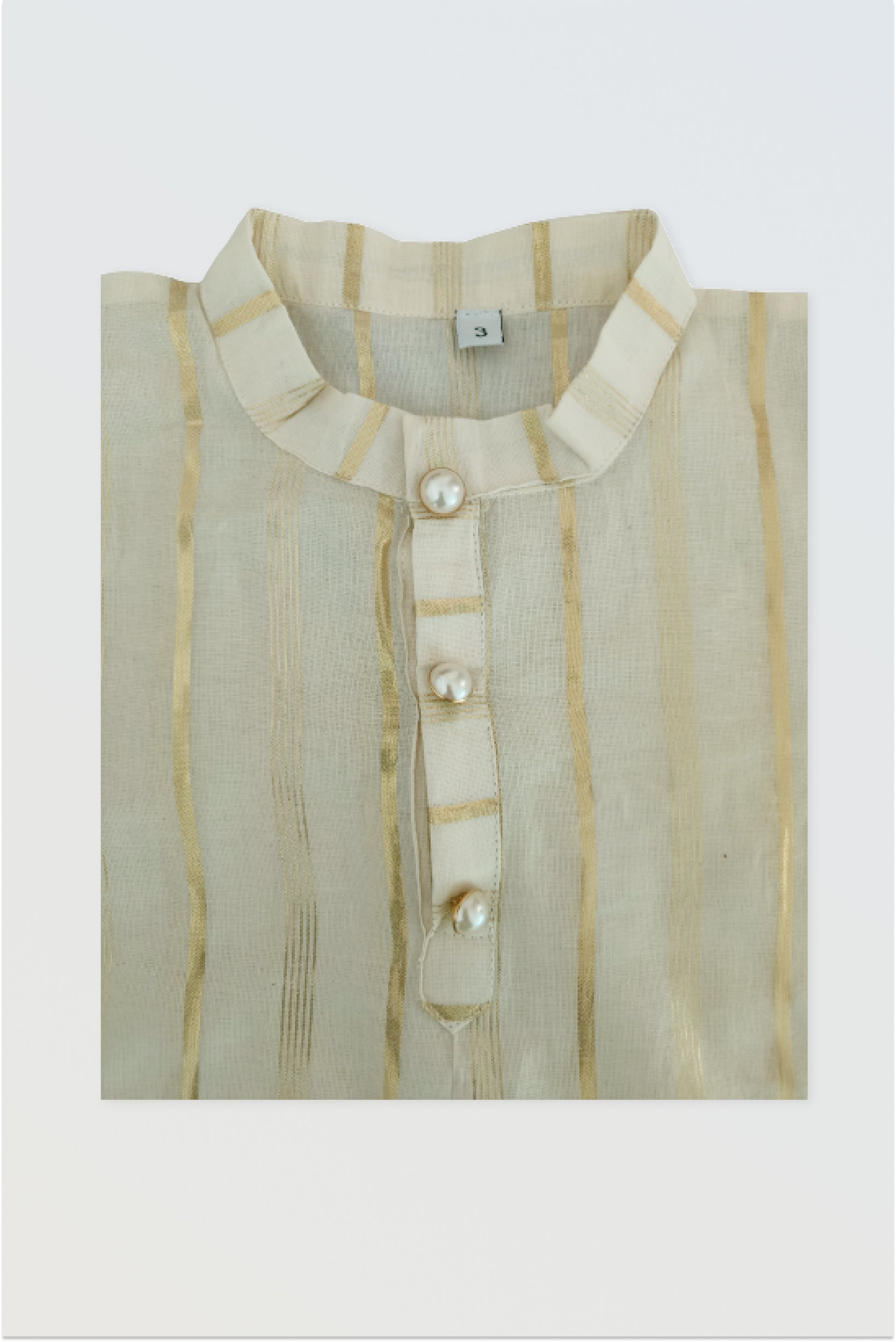 Close up of traditional kasavu cotton fabric with golden lurex border detail