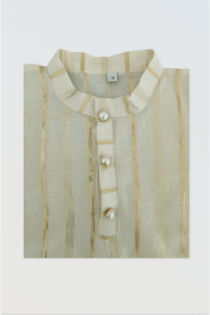 Close up of traditional kasavu cotton fabric with golden lurex border detail