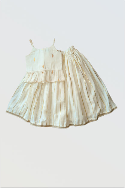 Kasavu lehanga choli set flat lay showing strappy blouse and flared skirt with golden border