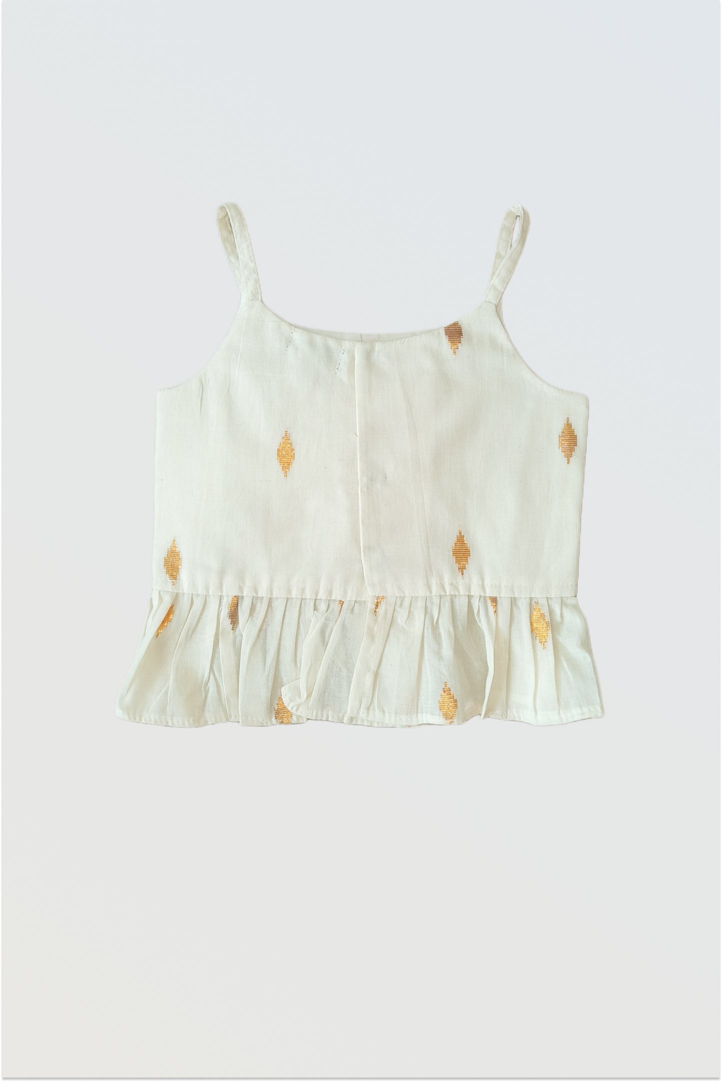 Close up of kasavu strappy choli with frilled hem and hook closure