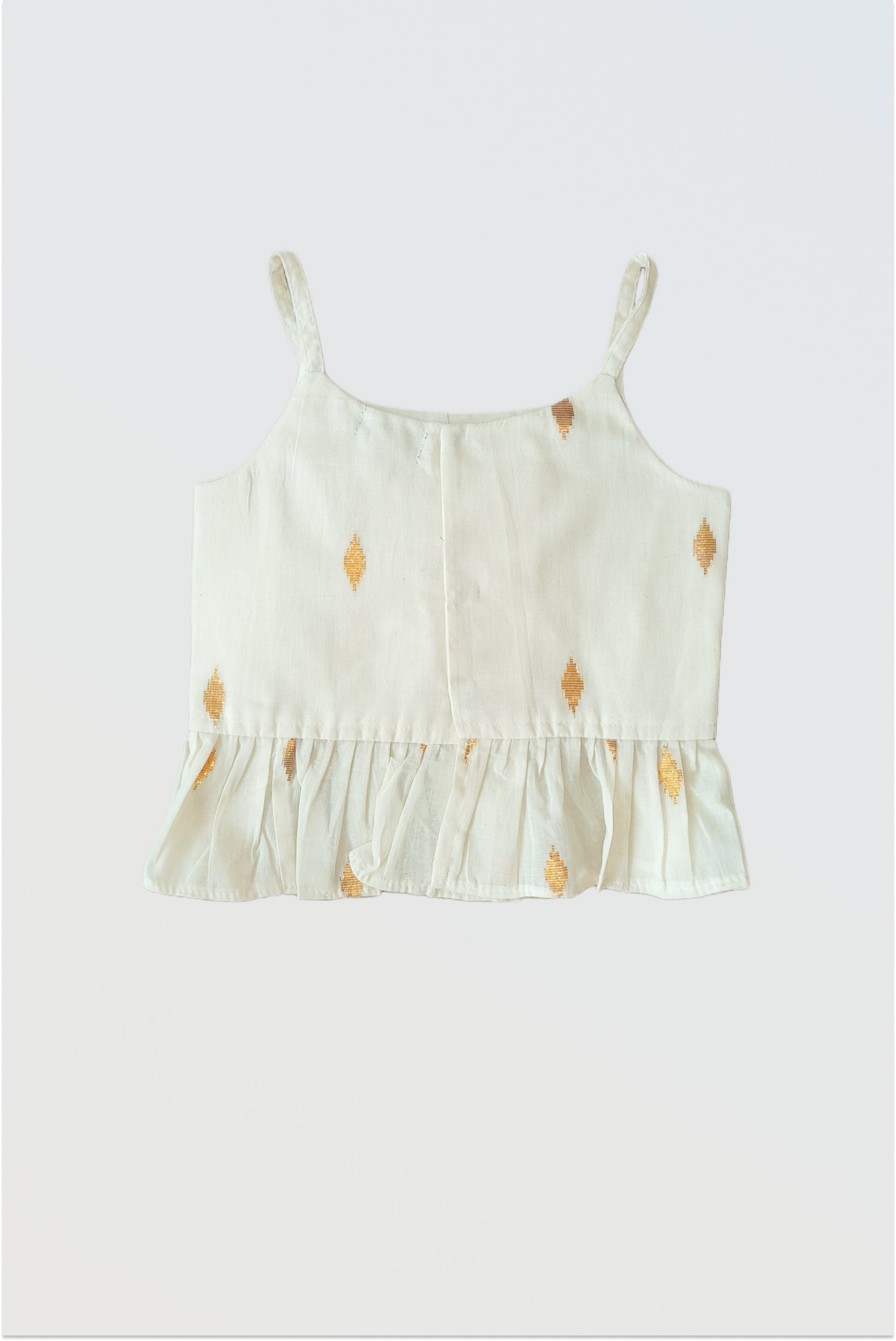 Close up of kasavu strappy choli with frilled hem and hook closure