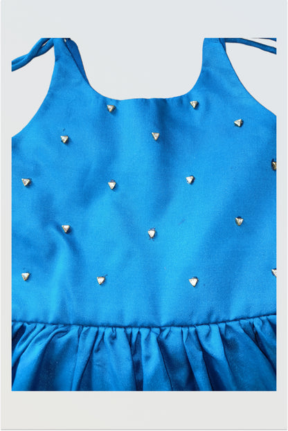 Detailed view of kundan stone work pattern on art silk baby dress