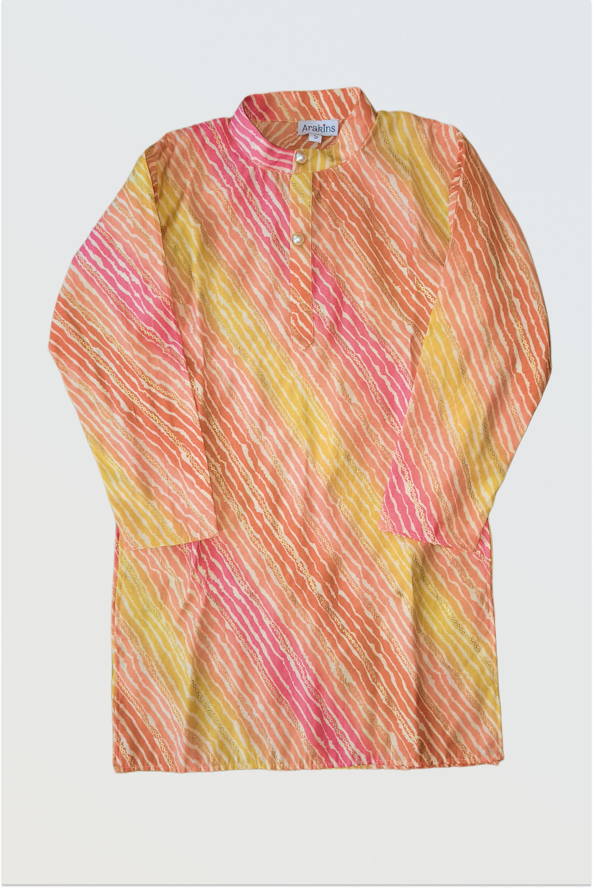 Close up of traditional lehariya pattern with golden foil print detail on kurta