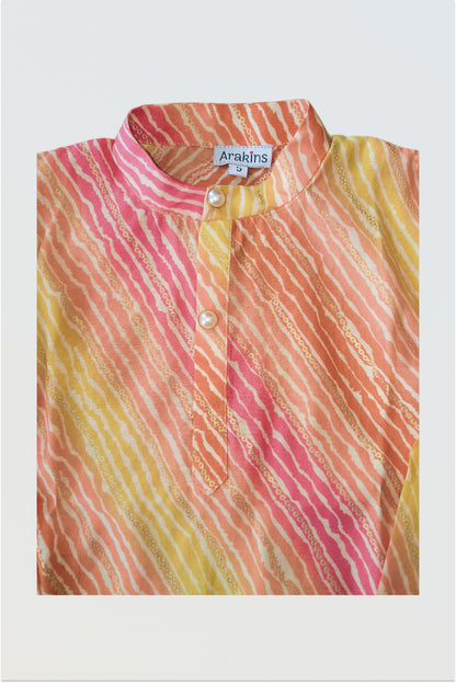 Close up of traditional lehariya pattern with golden foil print detail on kurta