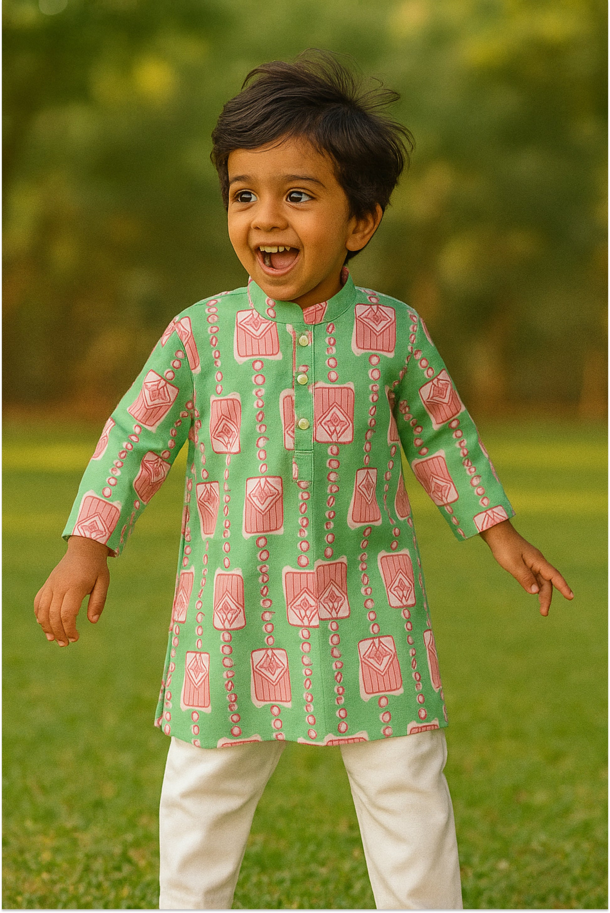 Boy wearing mint green kurta pyjama set with pink block prints - modern ethnic wear