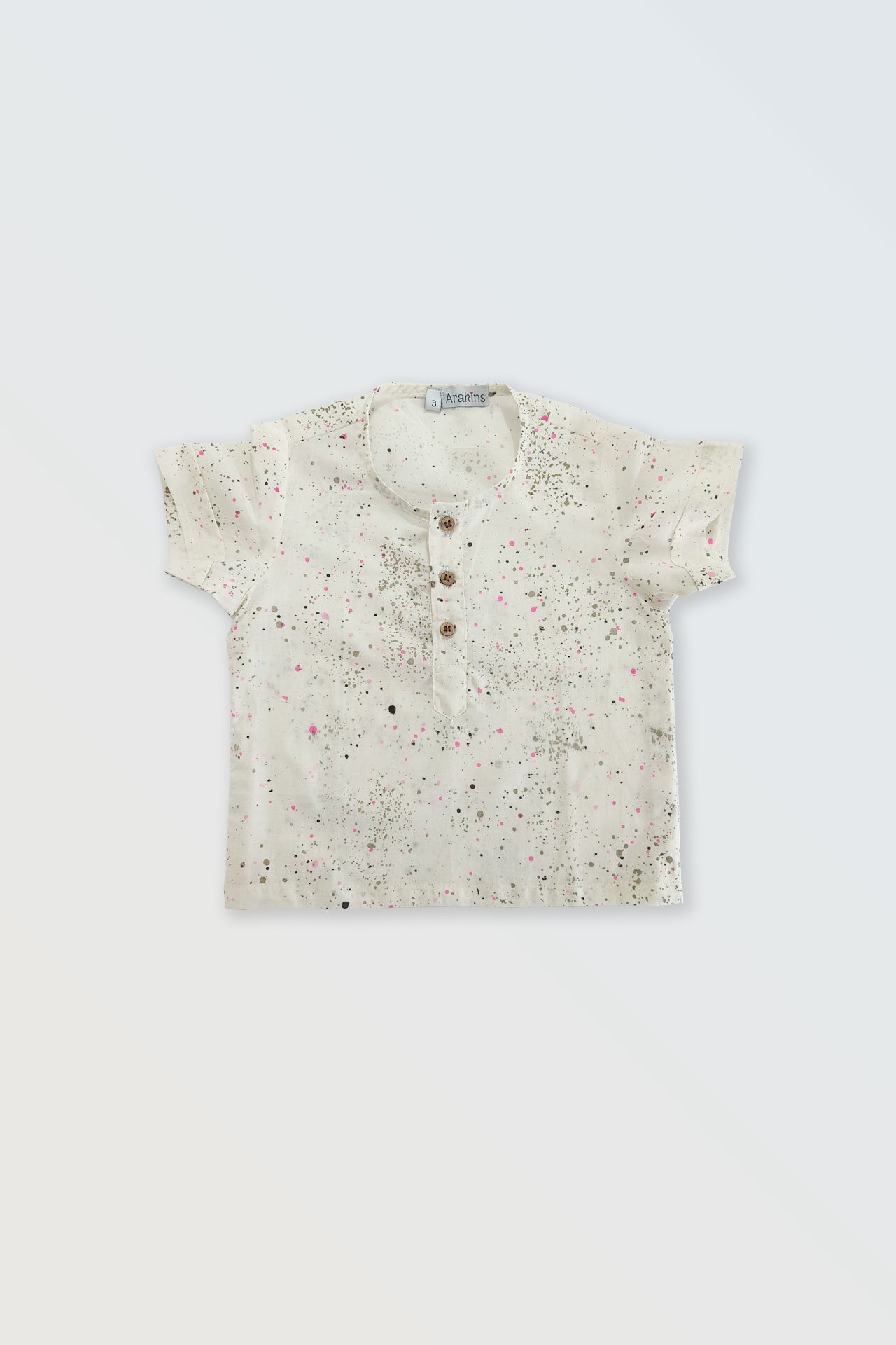 Front view of white paint dots button shirt for kids - unisex summer casual wear