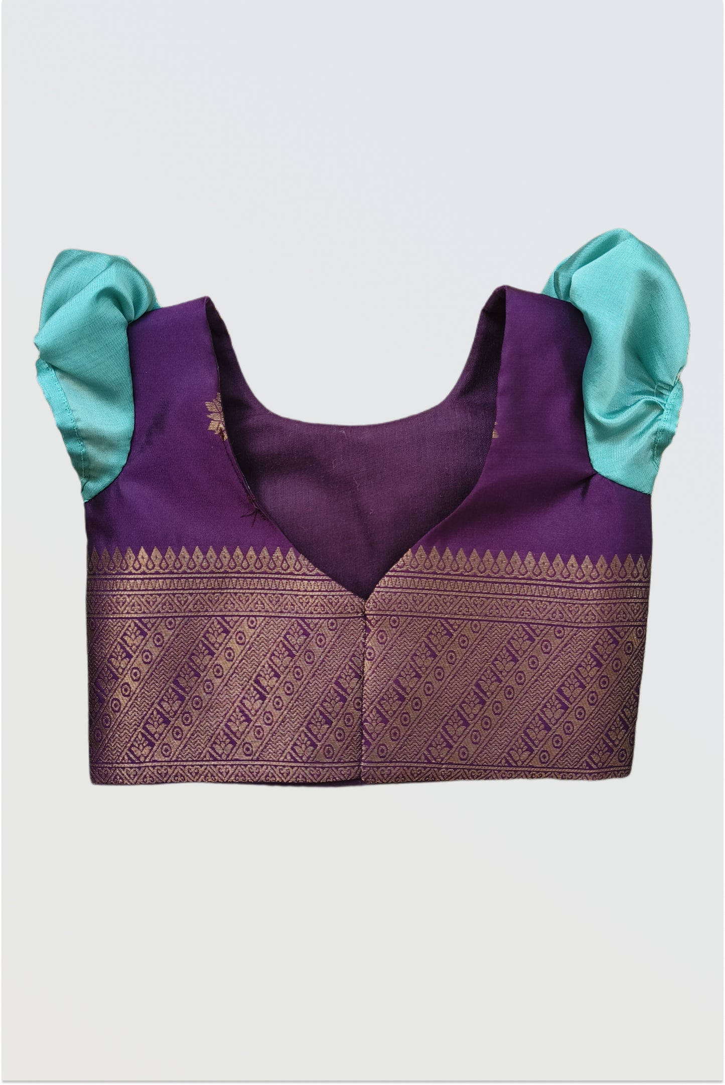 Back view of pattu pavadai blouse showing hook closure and short sleeve construction