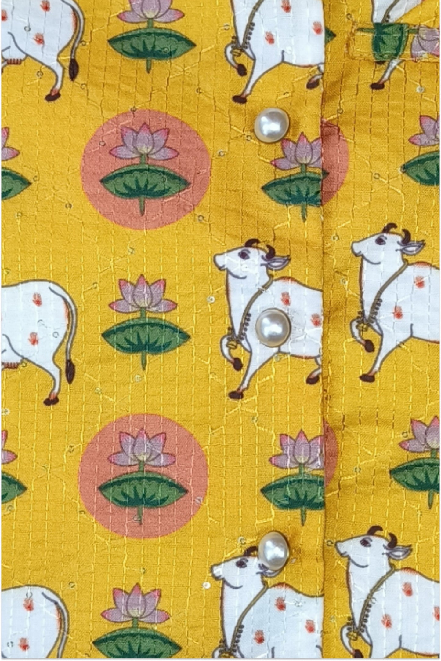 Close up of pichwai print jacket showing kantha embroidery and sequin detail