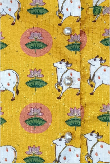 Close up of pichwai print jacket showing kantha embroidery and sequin detail