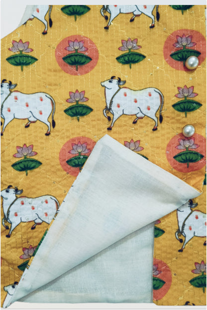 Close up of pichwai print jacket showing kantha embroidery and sequin detail