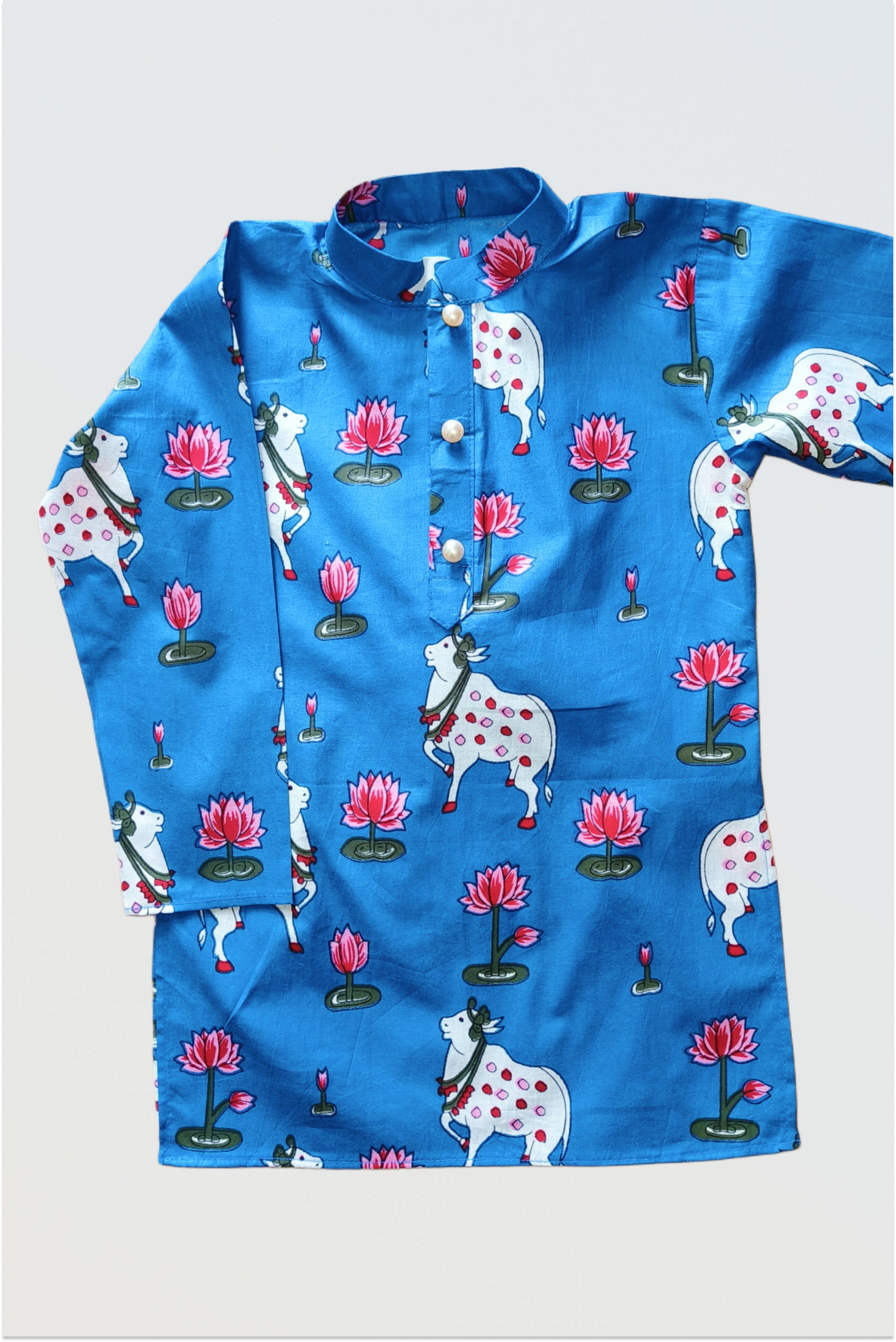 Close up of pichwai printed kurta pyjama set for boys showing traditional Rajasthani art patterns - cow, flowers