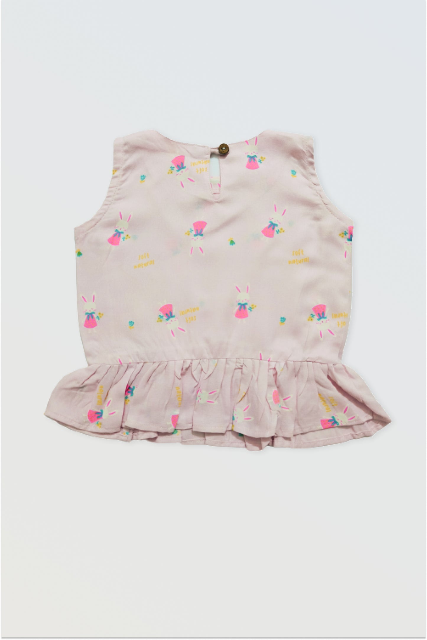 Back view of pink ruffle top showing button closure detail