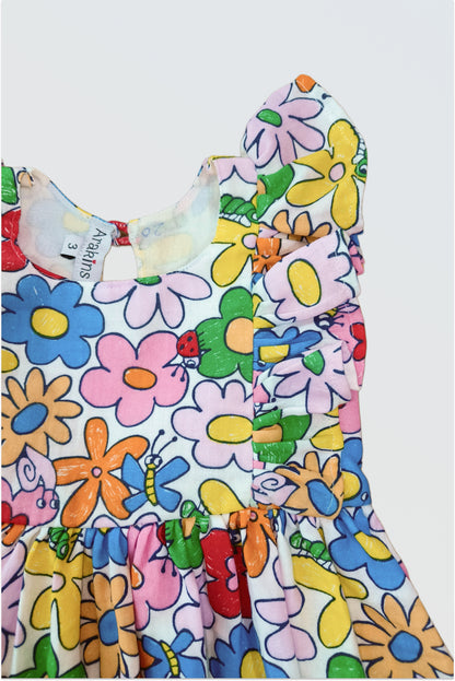 Close up of rainbow petals botanical floral print on cotton double cloth showing pink yellow brown peach flowers