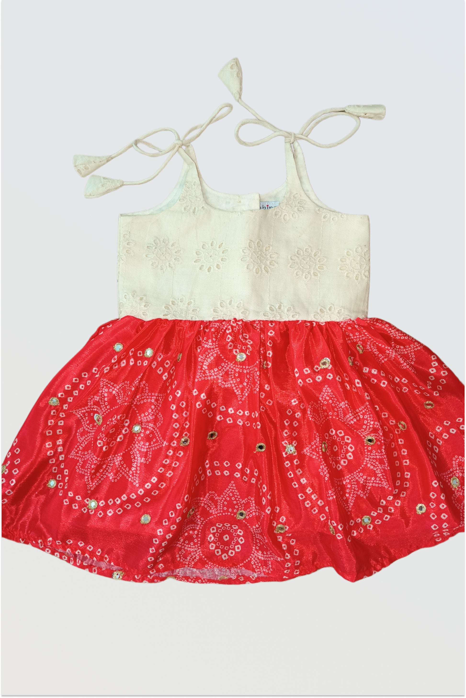 Red Bandhani tie-up frock for baby girls with ivory hakoba bodice and mirror work - adjustable ethnic dress
