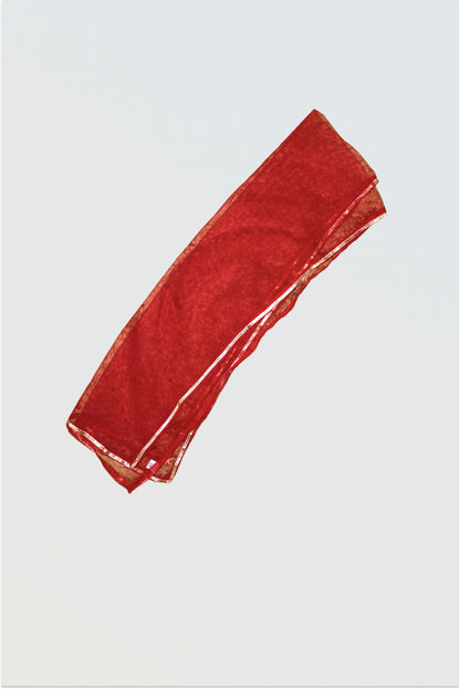 Contrasting red net dupatta with decorative lace trim for yellow sharara set