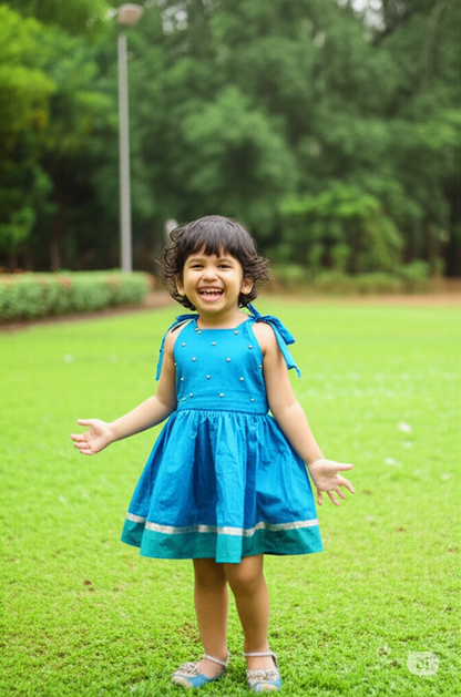 Baby wearing traditional art silk tie-up frock with kundan stone embellishments - designer ethnic dress